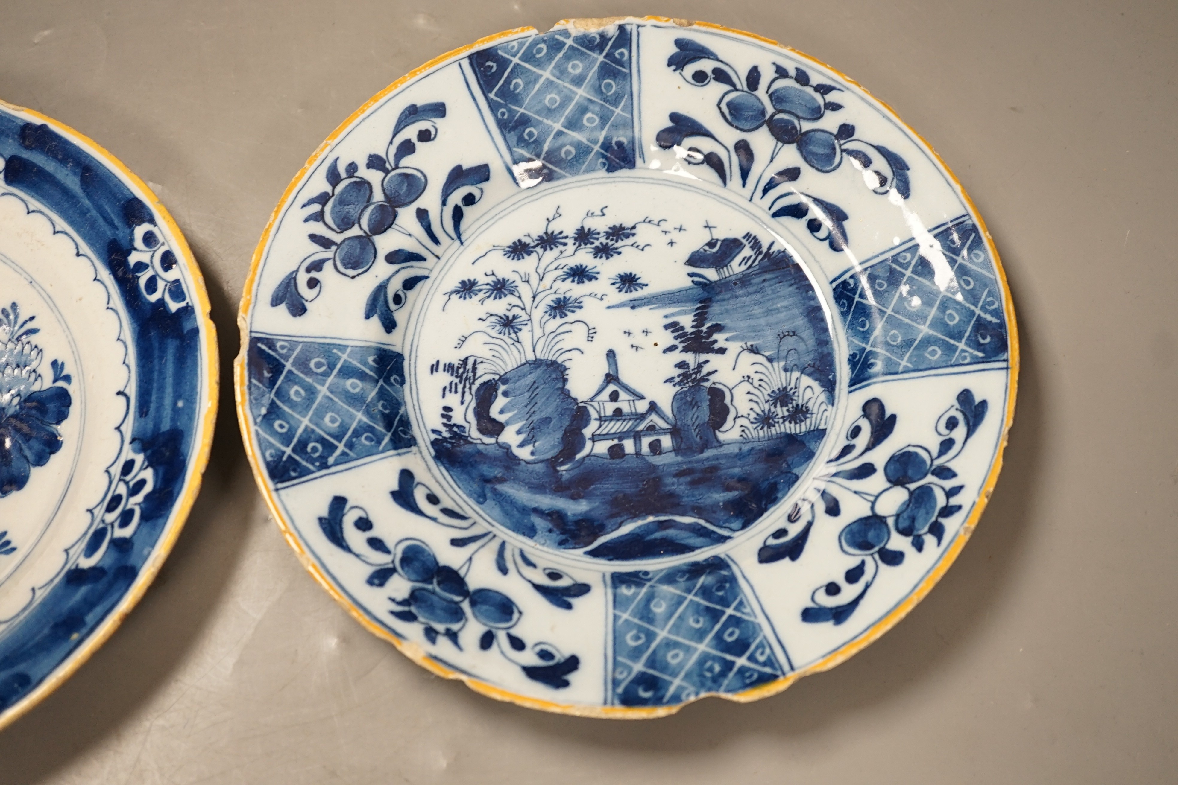 Two 18th century Dutch Delft blue and white plates, largest 23cms diameter